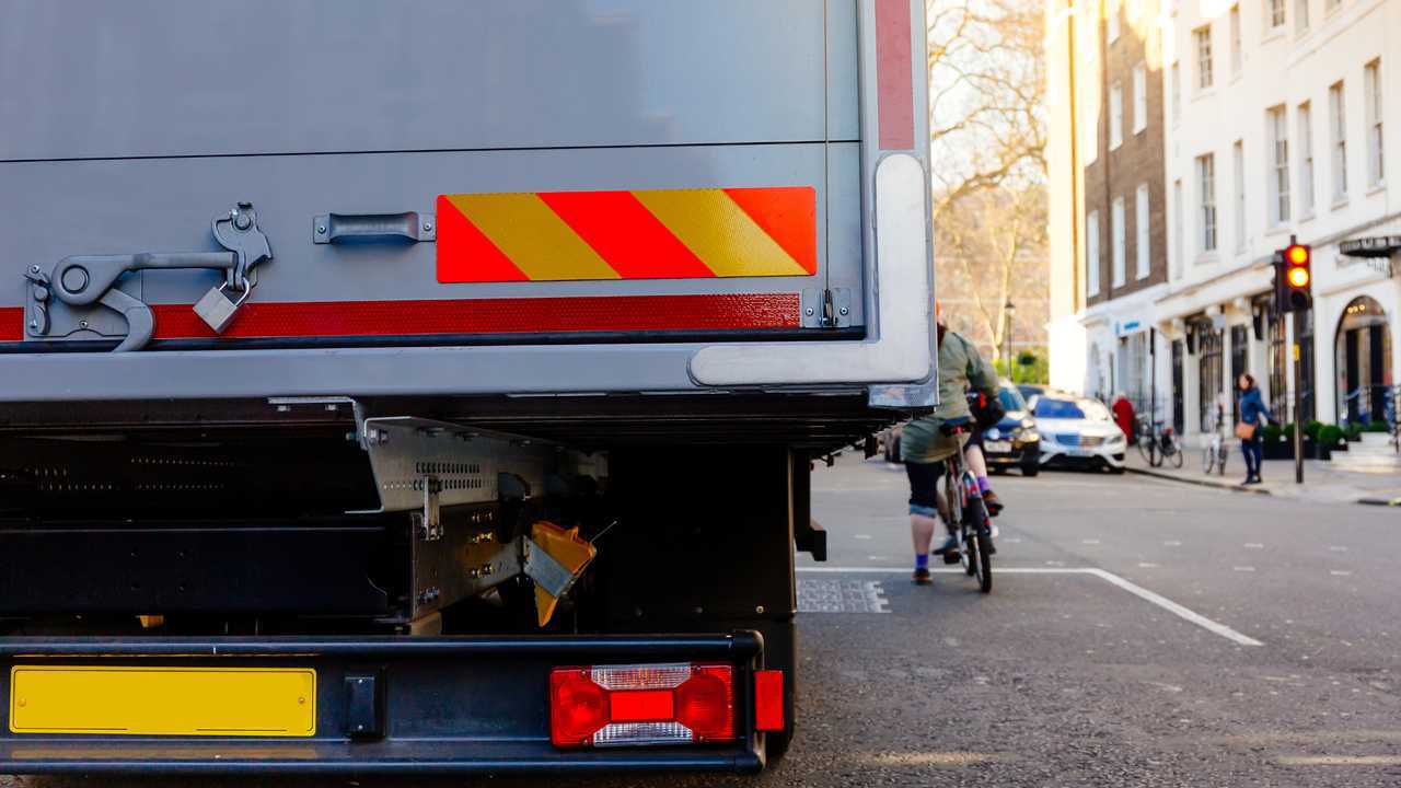 HGV and bicyclist share the road in London