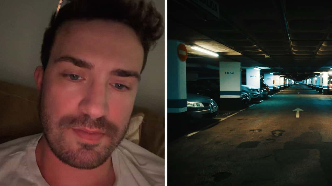 man drives through parking garage