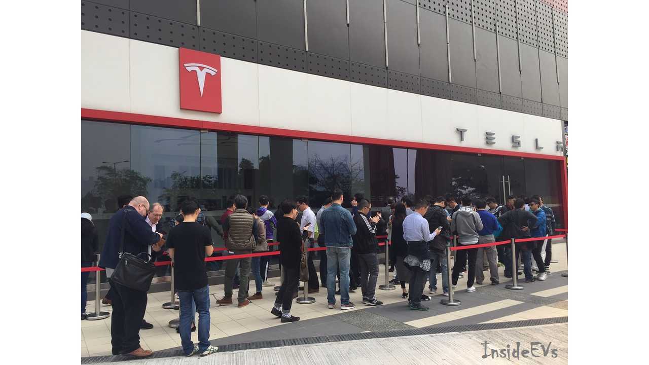 Large crowd continues to build up after the store opens.