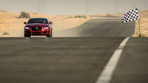 Jaguar XJR races man on jet pack