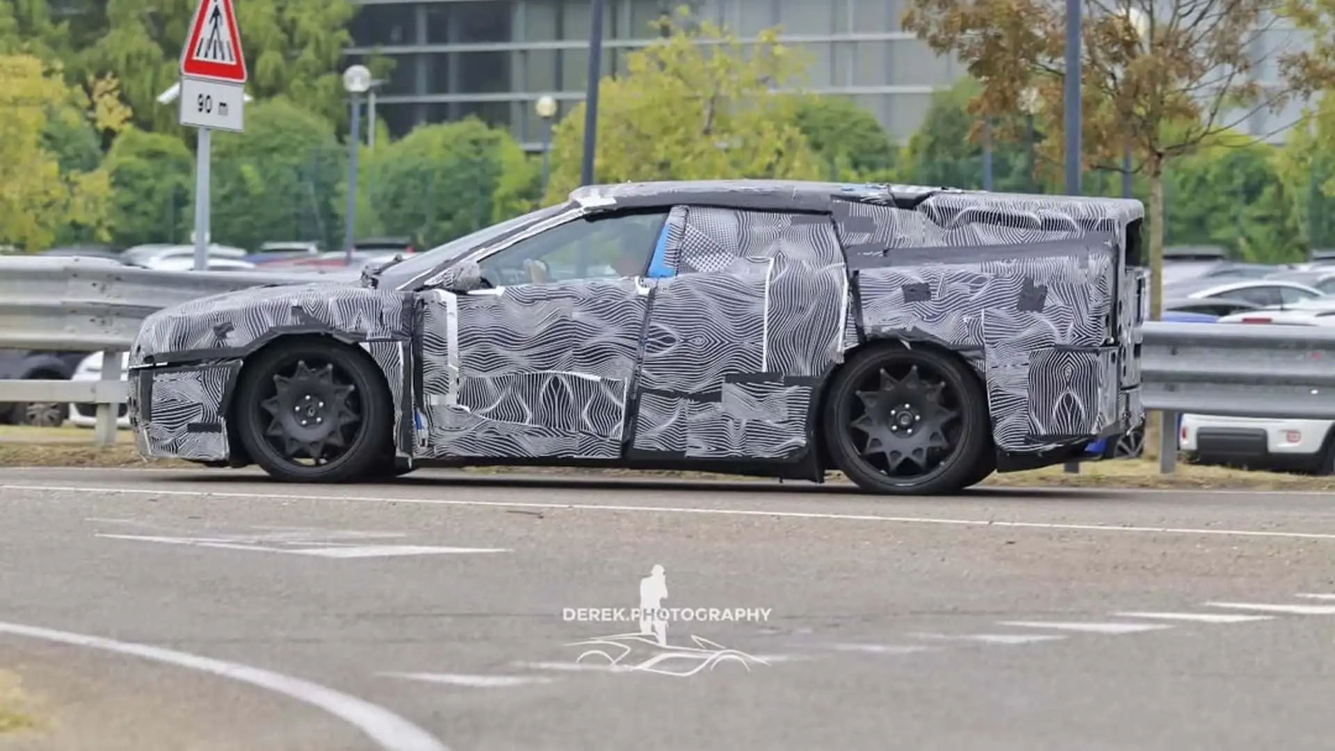 https://cdn.motor1.com/images/mgl/xqPAqw/s1/ferrari-ev-with-production-body-spy-photo.webp
