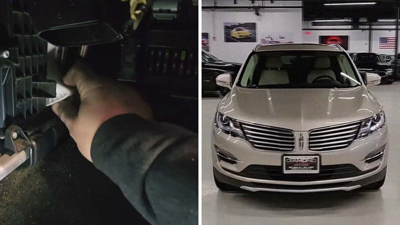 Mechanic works on Lincoln