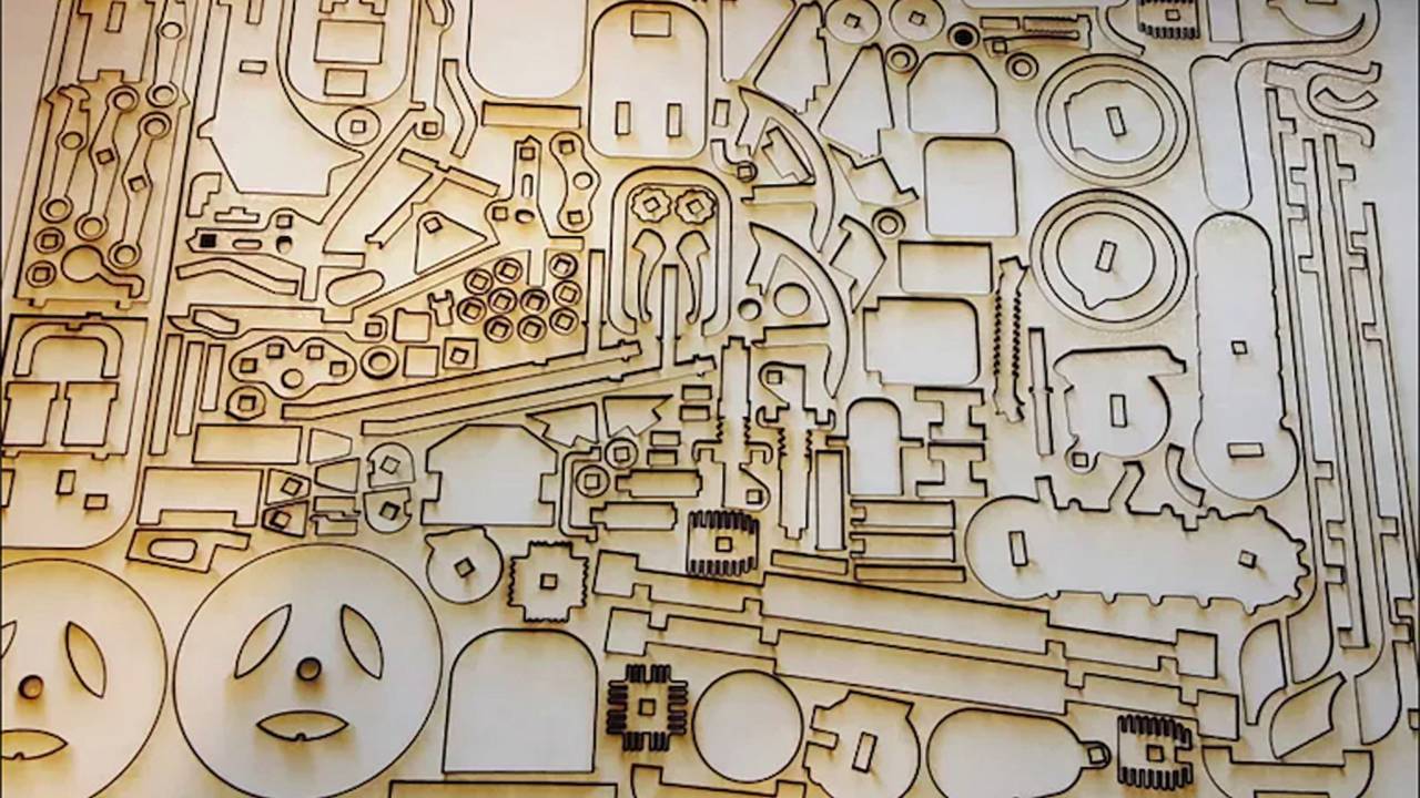 Some of the 180 laser-cut pieces that make up the Lasercompo set
