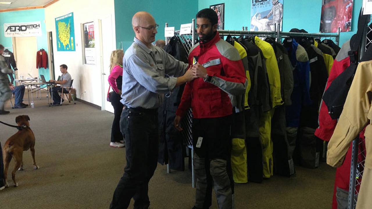 Aakash trying on a two-piece Roadcrafter.