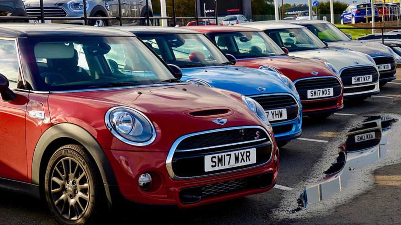New Mini Coopers on dealership forecourt Edinburgh Scotland UK