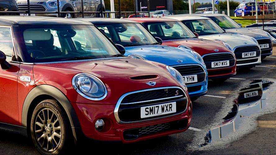 New Mini Coopers on dealership forecourt Edinburgh Scotland UK