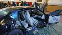 Porsche Panamera being cut apart from the fire brigade