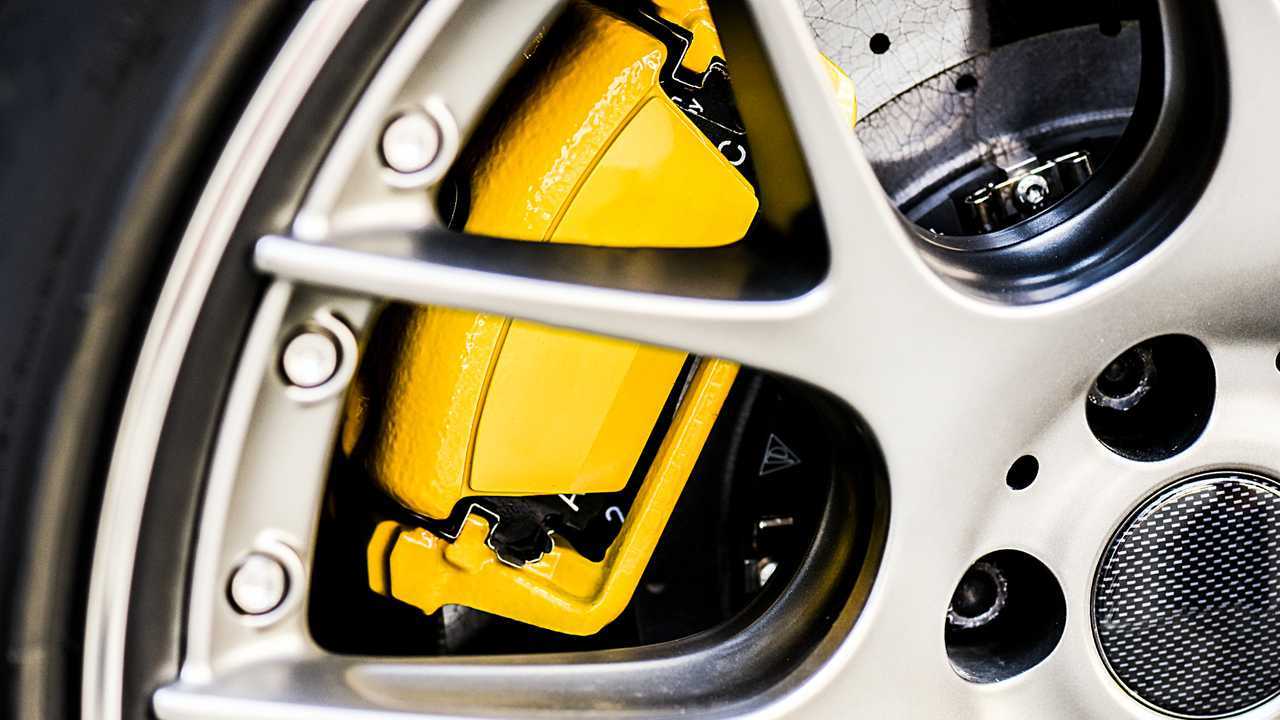 Alloy wheel close up showing yellow painted brake calliper