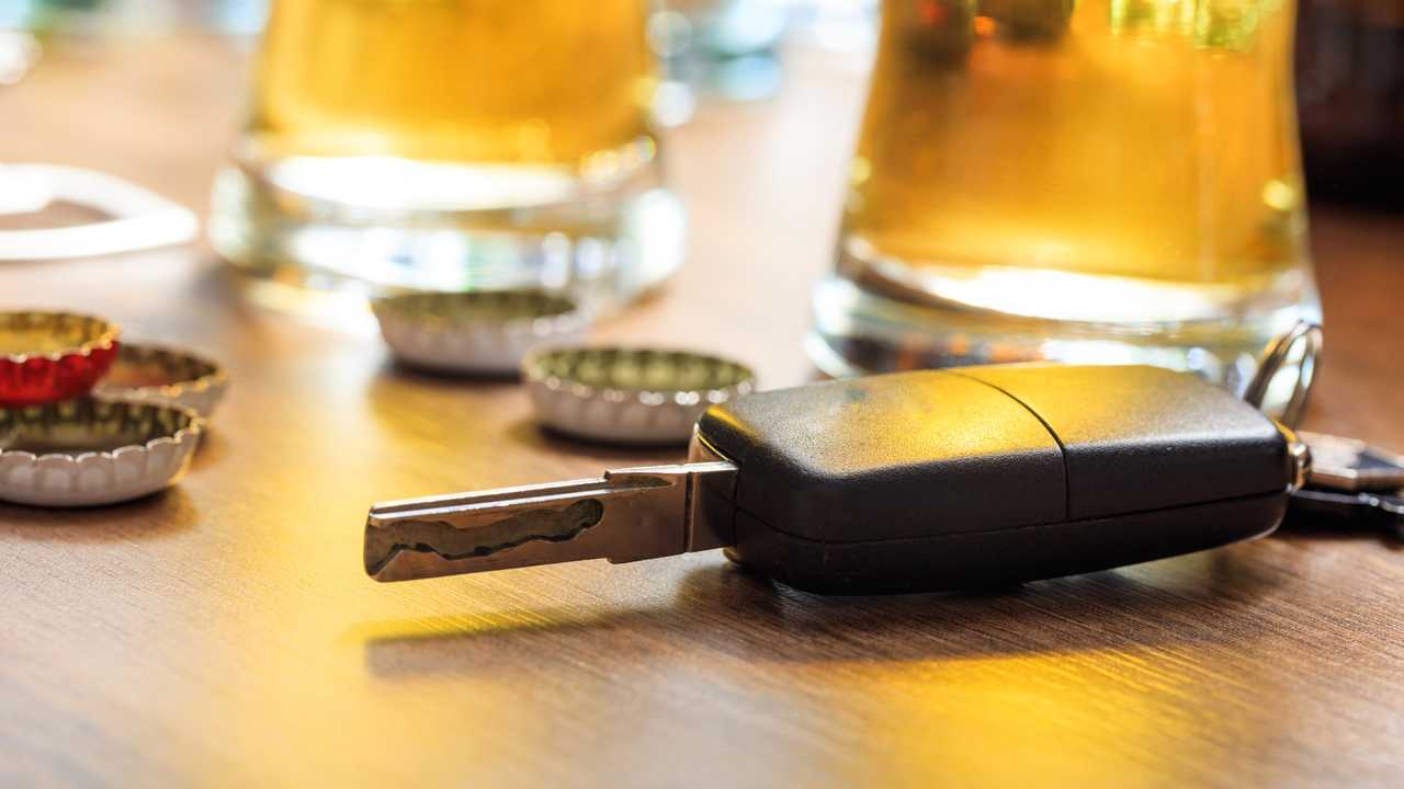 Car key on a wooden table in a pub