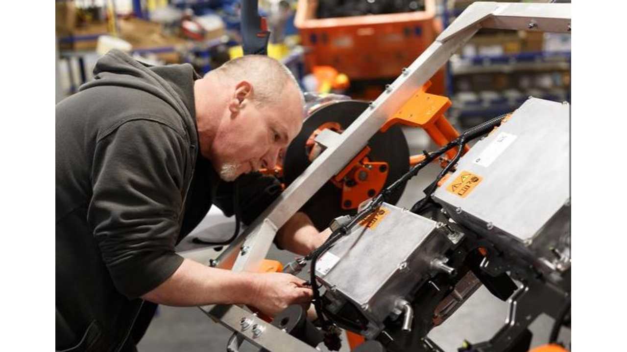 An employee at the Windsor Assembly plant builds a super module for the Chrysler Pacifica Hybrid