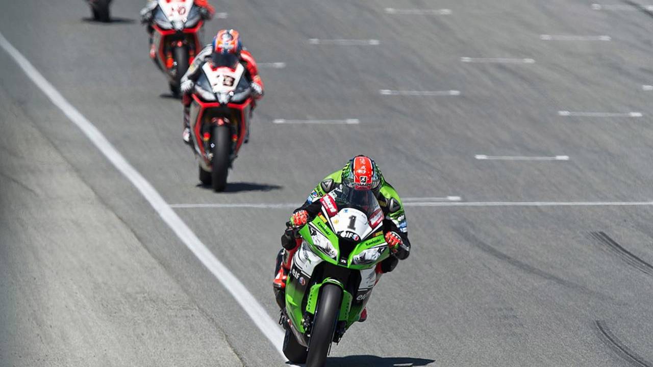 Tom Sykes (1) holding off Marco Melandri (33) and Sylvain Guintoli (50) at Laguna Seca. Sykes would lose the title to Guintoli in dramatic fashion in the last two rounds of the 2014 season. (Photo courtesy Kawasaki Racing.)