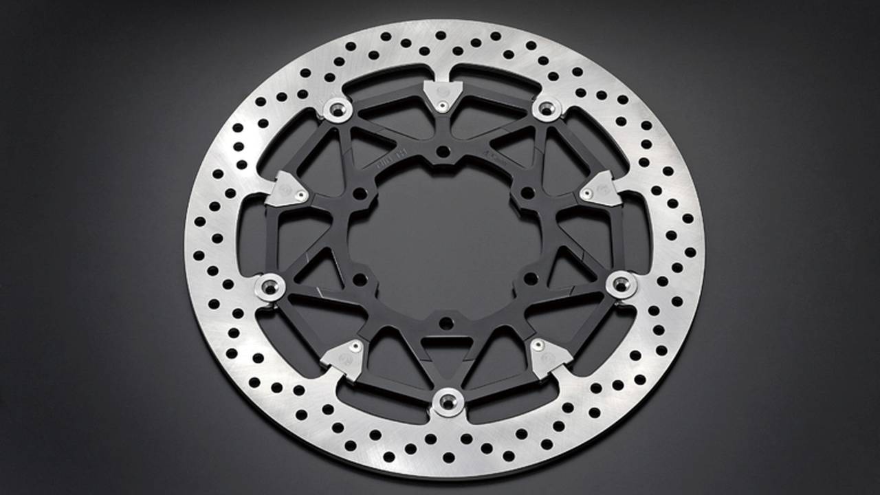 <strong>Brembo T-drive floating mounts are lighter and have more contact area between the disc and inner carrier which requires fewer mounts (10) compared to (12) conventional mounts which reduces weight gain from the larger discs. But T-drive mounts produce a unique rattle so to combat this, Suzuki also used conventional spring-loaded pin mounts. Using both T-drive and pin mounts reduces rattle.</strong>
