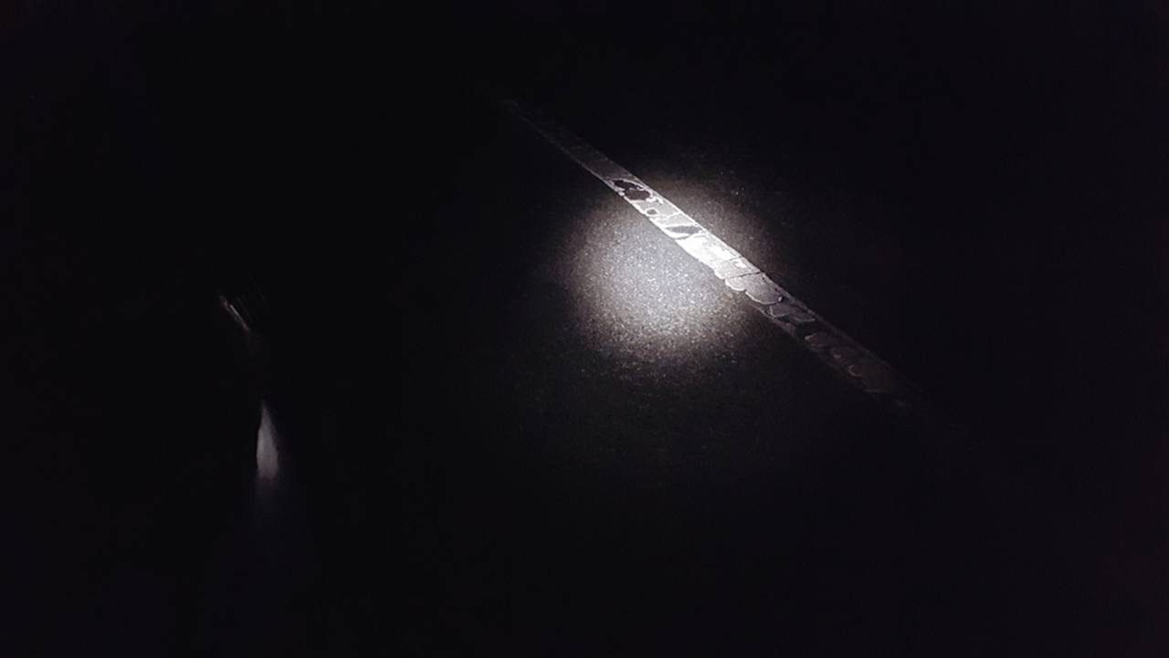 A handheld flashlight provided enough light to keep me on the road and out of the ditch as long as I kept my speed to about 5 mph. Photo by Panhead Jim.